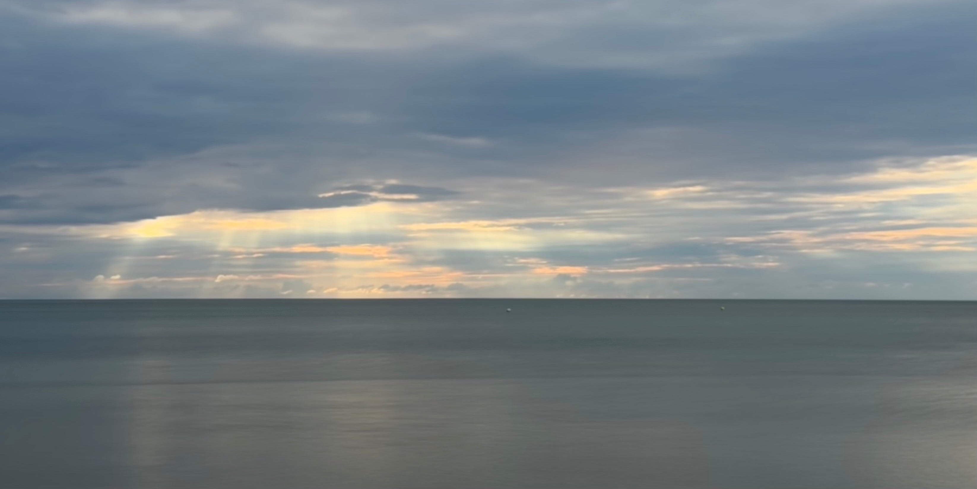 Serene ocean horizon and cloudy sky by Samson California